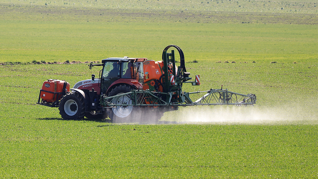 Tractor sprays paddock
